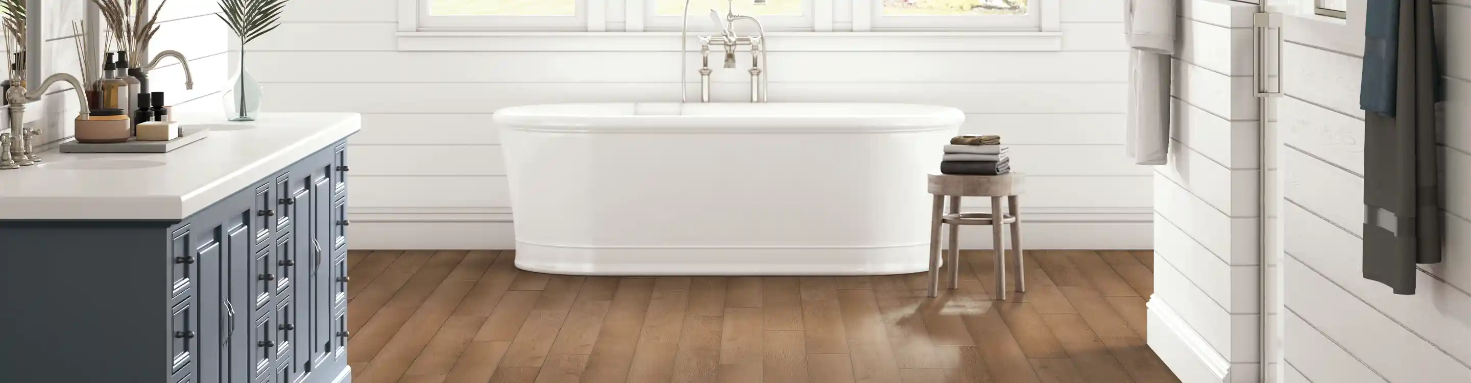 hardwood flooring in bathroom with soaker tub
